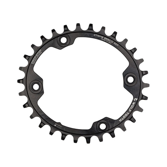 Corona monocorona ovale WOLF TOOTH ELLIPTICAL 96 BCD 11 velocità Shimano XTR M9000/9020, 4 fori, 96 mm, nera — vista della corona su sfondo bianco