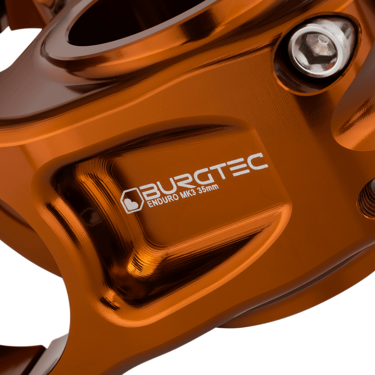 Attacco manubrio BURGTEC ENDURO MK3 bronzo — dettaglio del corpo lavorato