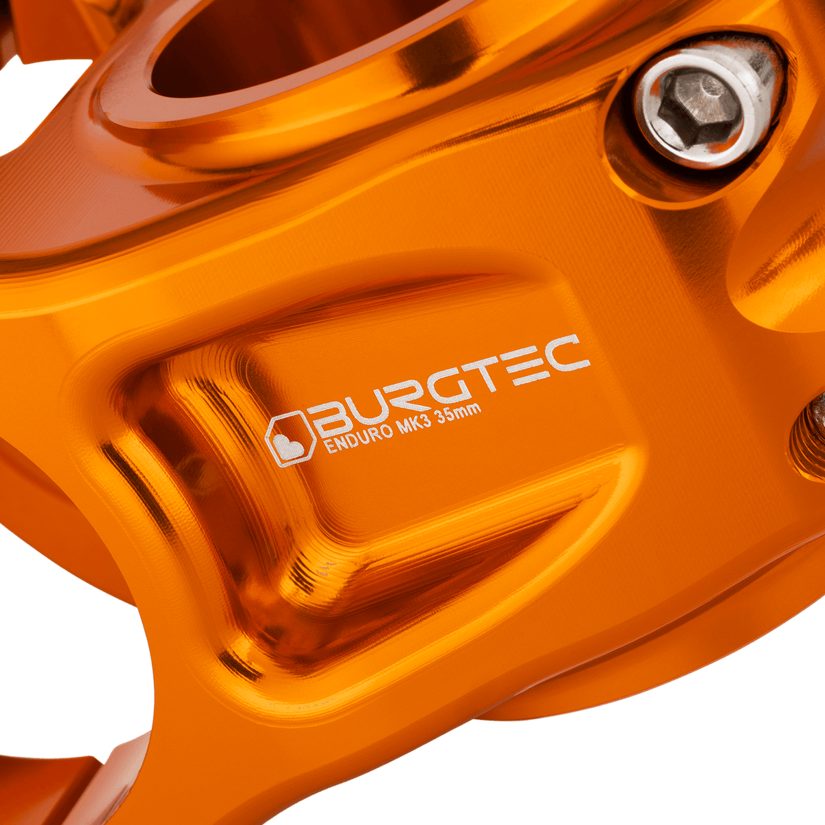 Attacco manubrio BURGTEC ENDURO MK3 arancione — dettaglio del corpo lavorato