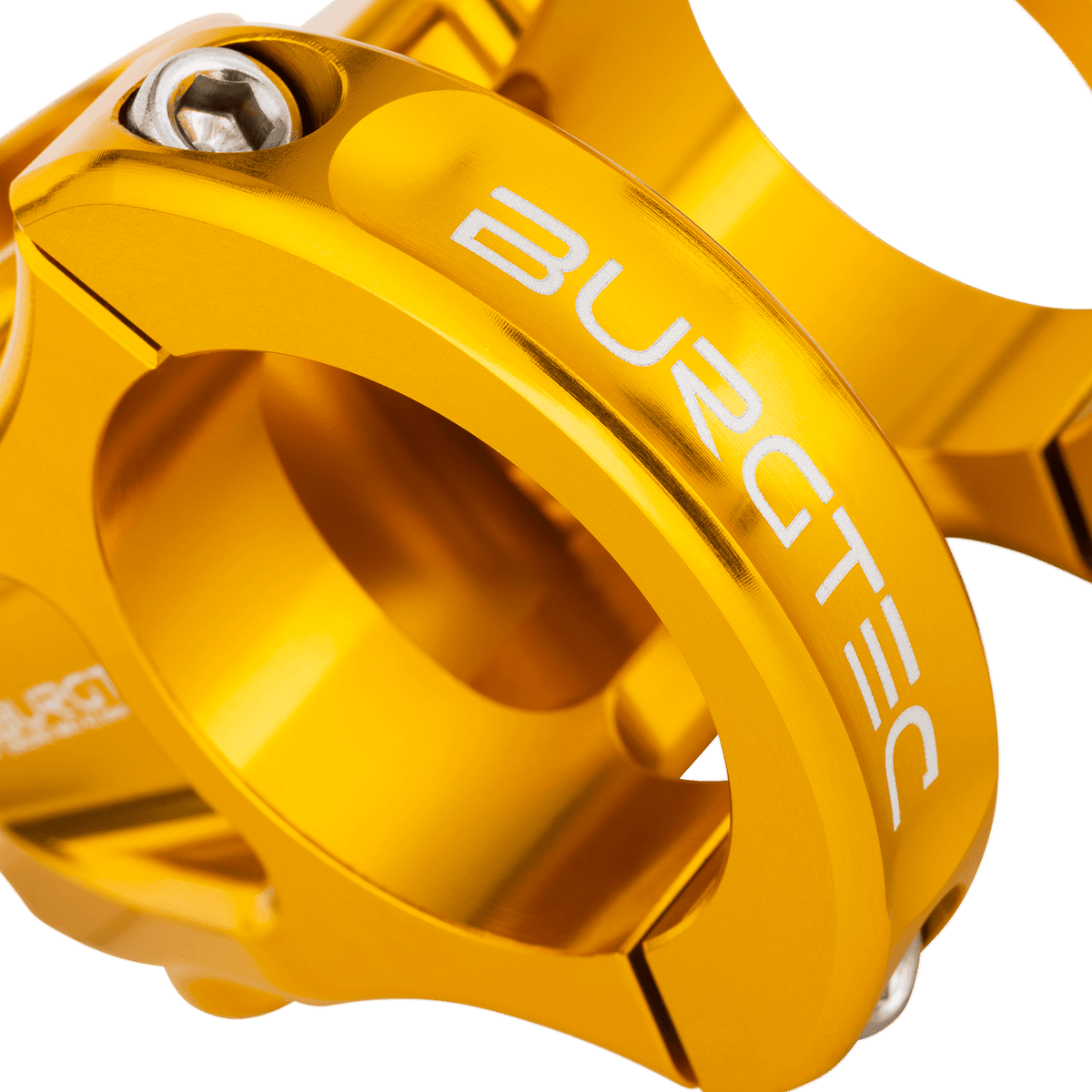 Attacco manubrio BURGTEC ENDURO MK3 oro — dettaglio del morsetto del manubrio