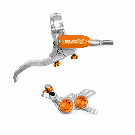 Freno HOPE TECH 4 EVO GR4 argento/arancione — leva e pinza su sfondo bianco